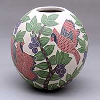 A polychrome jar decorated with a sgraffito-and-painted bird, branch, leaf and berry design
 by Blanca Arras of Mata Ortiz and Casas Grandes