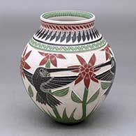 A polychrome jar decorated with a sgraffito and painted hummingbird, flower, leaf, branch and geometric design
 by Martin Olivas of Mata Ortiz and Casas Grandes