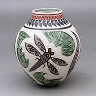 A polychrome jar decorated with a sgraffito and painted parrot, dragonfly, serpent and geometric design
 by Eduardo Olivas of Mata Ortiz and Casas Grandes