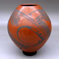 A black on red jar decorated with a three-panel Paquime-style geometric design
 by Juan Quezada Sr of Mata Ortiz and Casas Grandes