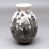 A black on white jar with a flared rim and decorated with a sgraffito Day of the Dead at the cemetery design
 by Hector Javier Martinez of Mata Ortiz and Casas Grandes