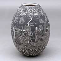 A black on white jar decorated with a sgraffito Night of the Dead at the Cemetery with Native Americans and geometric design
 by Hector Javier Martinez of Mata Ortiz and Casas Grandes