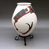 A polychrome jar with a flared rim and decorated with a two-panel carved, sgraffito and painted serpent, checkerboard and geometric design
 by Roberto Almeraz of Mata Ortiz and Casas Grandes