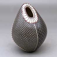 A polychrome ovoid seed pot decorated with a four-panel tiny square and geometric design
 by Luz Elva Gutierrez of Mata Ortiz and Casas Grandes