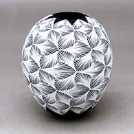 A black on white jar decorated with a geometric design
 by Aide Gonzalez of Mata Ortiz and Casas Grandes