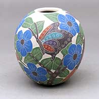 Click for a larger view A polychrome jar decorated with a sgraffito and painted butterfly, hummingbird, branch, leaf and flower design
by Blanca Arras of Mata Ortiz and Casas Grandes