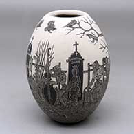 A black on white jar decorated with a sgraffito Day of the Dead at the cemetery design
 by Hector Javier Martinez of Mata Ortiz and Casas Grandes