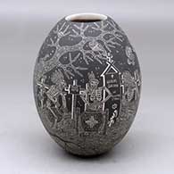 A black on white jar decorated with a sgraffito Night of the Dead at the cemetery design
 by Hector Javier Martinez of Mata Ortiz and Casas Grandes