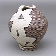 Click for a larger view A polychrome jar with a geometric cut opening and decorated with a lightly carved, sgraffito and painted geometric design, with a custom matching stand
 by Karla Lopez Cota of Mata Ortiz and Casas Grandes