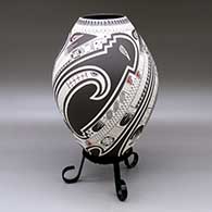 Click for a larger view A polychrome jar lightly carved and painted with a three panel serpent, bird element, sickle and geometric design
 by Lazaro Ozuna of Mata Ortiz and Casas Grandes