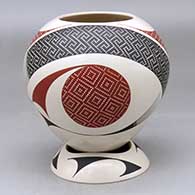 A polychrome jar decorated with a two panel tiny square and geometric design, plus a custom matching stand
 by Elias Pena of Mata Ortiz and Casas Grandes