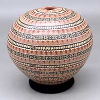 A polychrome seed pot decorated with a sgraffito and painted geometric design
 by Angela Corona of Mata Ortiz and Casas Grandes