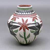 A polychrome jar decorated with a lightly carved, sgraffito and painted hummingbird, flower, plant and geometric design
 by Martin Olivas of Mata Ortiz and Casas Grandes