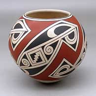 A Ramos polychrome jar decorated with a four panel geometric design
 by Sabino Villalba of Mata Ortiz and Casas Grandes