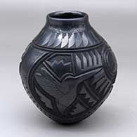 Click for a larger view A black jar decorated with a carved and sgraffito hummingbird, serpent, flower, feather and geometric design
 by Martin Olivas of Mata Ortiz and Casas Grandes