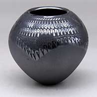 A black on black jar decorated with a geometric design
 by Susy Martinez of Mata Ortiz and Casas Grandes
