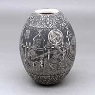 A black on white jar decorated with a sgraffito Night of the Dead at the cemetery and geometric design
 by Hector Javier Martinez of Mata Ortiz and Casas Grandes
