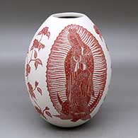 A red on white jar decorated with a sgraffito Virgin of Guadalupe, rose, vine and geometric design
 by Hector Javier Martinez of Mata Ortiz and Casas Grandes