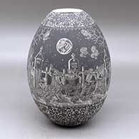 A black on white jar decorated with a sgraffito Night of the Dead at the cemetery and geometric design
 by Hector Javier Martinez of Mata Ortiz and Casas Grandes