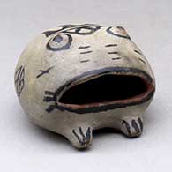 Click for a larger view A polychrome frog figure with an open mouth and geometric design on its back and sides
by Unknown of Cochiti
