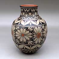 A polychrome jar decorated with a flower and geometric design
 by Lisa Holt of Cochiti