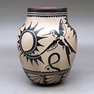 A polychrome jar decorated with a hummingbird, dragonfly and geometric design
 by Virgil Ortiz of Cochiti