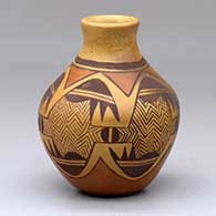 A small jar with fire clouds and decorated with an Awatovi star and a stylized migration pattern design
 by Darlene Nampeyo of Hopi