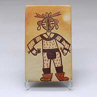 A polychrome tile decorated with a katsina design and fire clouds
 by Patricia Honie of Hopi