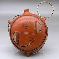 A polychrome canteen with three loop handles and decorated on top with a geometric design
 by Nampeyo of Hano of Hopi