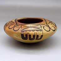 A polychrome seed pot decorated with a four panel bird element and geometric design
 by Nampeyo of Hano of Hopi