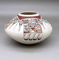A polychrome seed pot decorated with a four panel bird element, shard and geometric design
 by Rainy Naha of Hopi