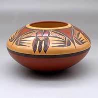 A polychrome jar decorated above the shoulder with a four-panel bird element and geometric design
 by Steve Lucas of Hopi