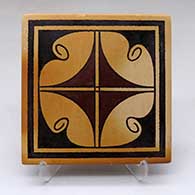 A polychrome tile decorated with a geometric design
 by Stetson Setalla of Hopi