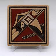 A polychrome tile decorated with a geometric design
 by Stetson Setalla of Hopi
