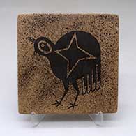 A black on yellow tile decorated with a quail and geometric design
 by Stetson Setalla of Hopi