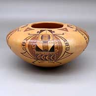 A polychrome jar decorated with a four panel water beetle woman and geometric design
 by Jean Sahmie of Hopi
