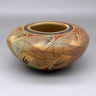 A polychrome jar decorated with a migration pattern design and fire clouds
 by Fannie Nampeyo of Hopi