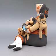 Polychrome storyteller with six children, plate, drum, and blanket, click or tap to see a larger version