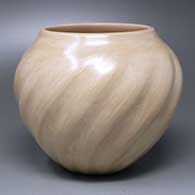 A polished tan melon jar with 14 ribs
 by Juanita Fragua of Jemez