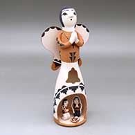 A standing polychrome Singing Angel with a nativity scene inside a cutout in her skirt
 by Angel Bailon of Jemez