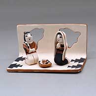 A polychrome single-piece nativity scene with Joseph, Mary and baby
 by Angel Bailon of Jemez