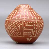 A red seed pot decorated with a sgraffito turtle, corn plant, feather, arrowhead and geometric design, click or tap to see a larger version