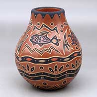 A polychrome jar decorated with a sgraffito and painted fish, turtle and geometric design
 by Glendora Fragua of Jemez