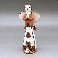 A polychrome Singing Angel figure with a nativity in her skirt
 by Angel Bailon of Jemez