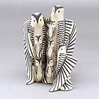 A standing eagle storyteller family with 6 chicks
 by Loren Wallowing Bull of Jemez