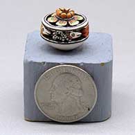 Miniature hanging triangular pot with a flared rim and geometric design
 by Thomas Natseway of Laguna