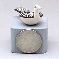A miniature black on white bird bowl decorated with a Mimbres and geometric design
 by Thomas Natseway of Laguna