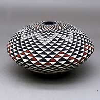 A polychrome seed pot decorated with a spiral mesa geometric design
 by Robert Kasero Sr of Laguna