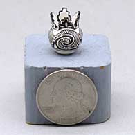 A miniature prayer jar decorated with a four panel Tularosa spiral and geometric design
 by Thomas Natseway of Laguna