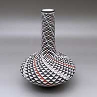 A polychrome tall neck seed pot decorated with a spiral mesa geometric design
 by Robert Kasero Sr of Laguna